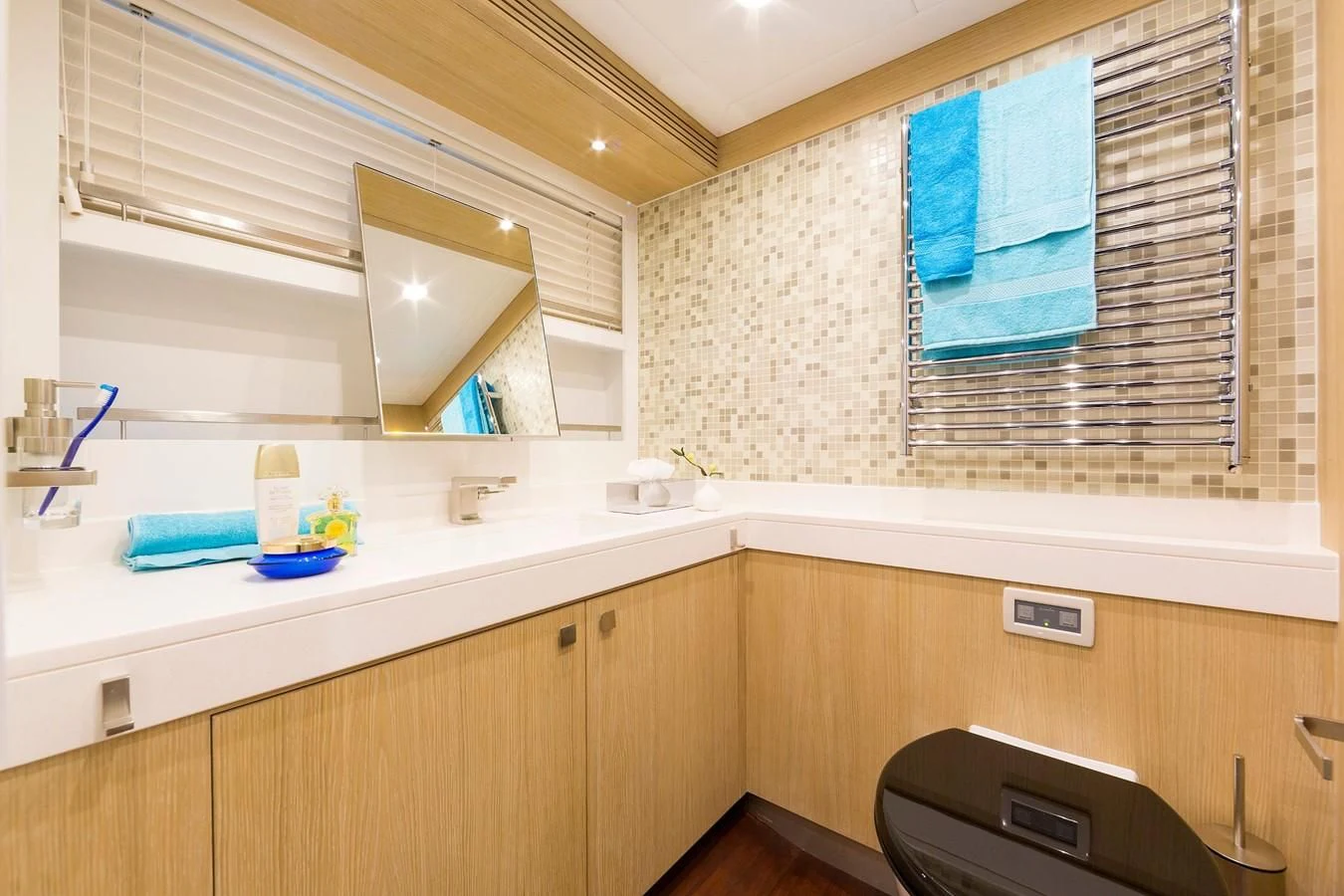 a bathroom with a sink and a mirror aboard O NOSO UNO Yacht for Sale