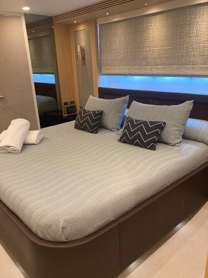 a bed with pillows aboard O NOSO UNO Yacht for Sale