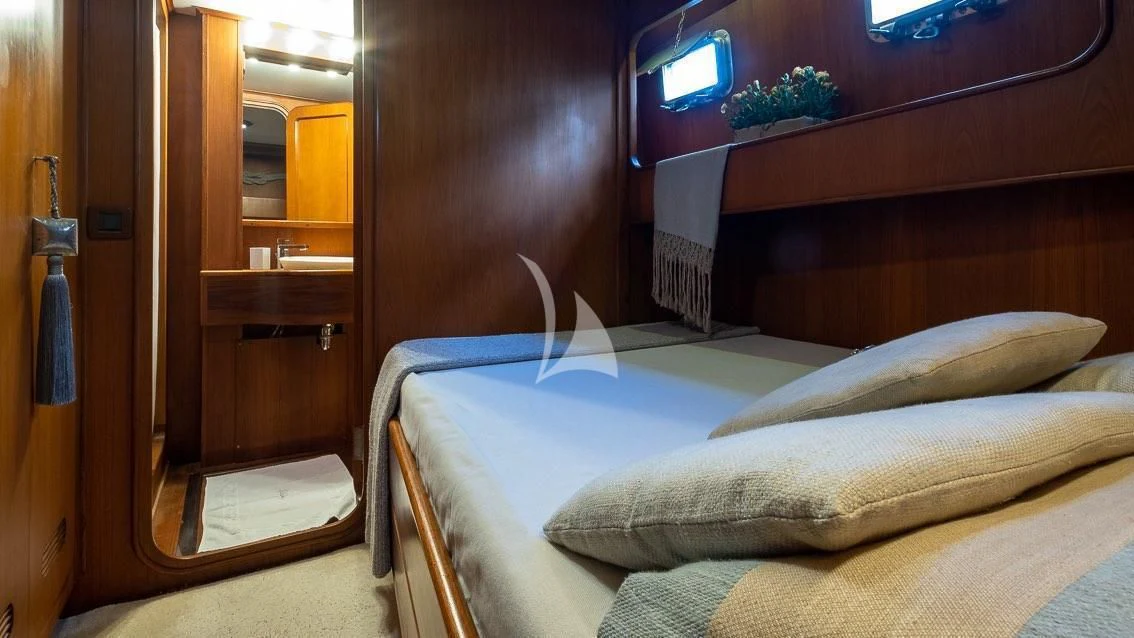 a bed in a room aboard LOTTY Yacht for Sale