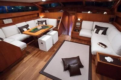 a room with a couch and a table aboard LOTTY Yacht for Sale