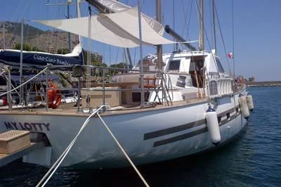 a boat docked at a pier aboard LOTTY Yacht for Sale