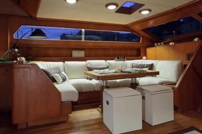 a room with a couch and a table aboard LOTTY Yacht for Sale