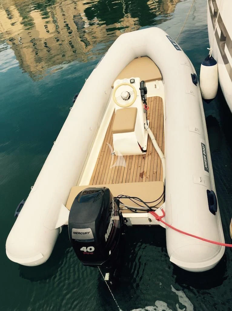 a white boat on the water aboard LOTTY Yacht for Sale