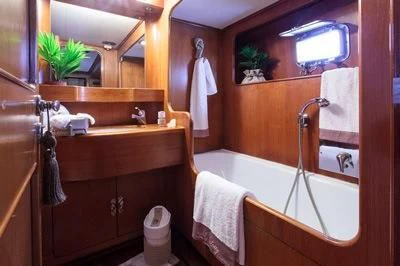 a bathroom with a large mirror aboard LOTTY Yacht for Sale
