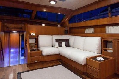 a room with a couch and a table aboard LOTTY Yacht for Sale
