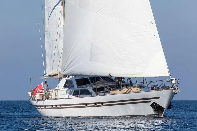 a white sailboat on the water aboard LOTTY Yacht for Sale