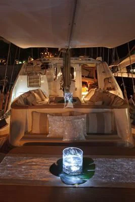 a bed with a round table aboard LOTTY Yacht for Sale
