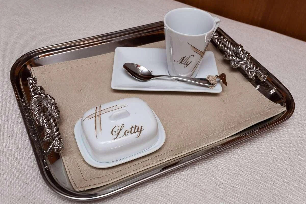 a plate with a cup and spoon on it aboard LOTTY Yacht for Sale