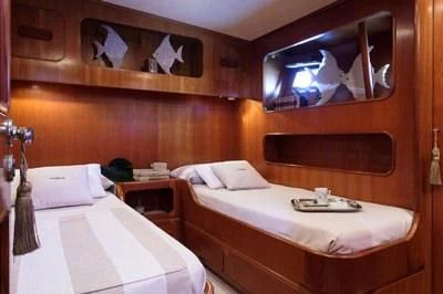 a couple of beds in a room aboard LOTTY Yacht for Sale