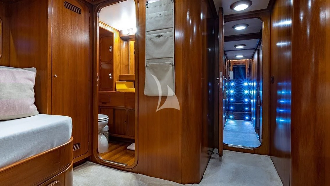 a room with a bed and a closet aboard LOTTY Yacht for Sale