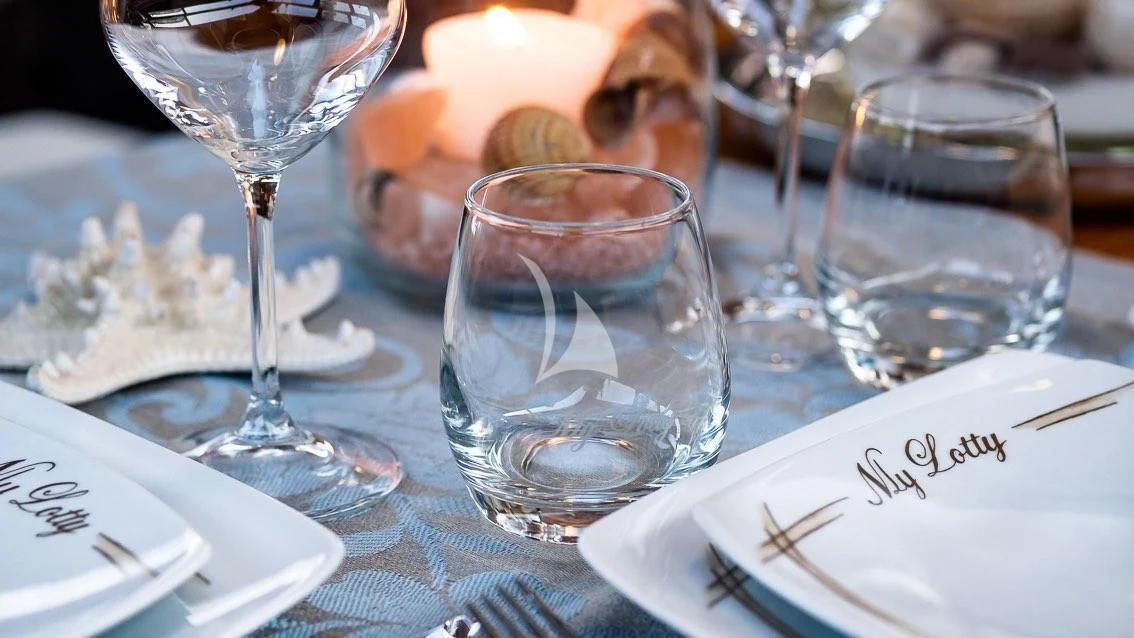 a glass of water on a table aboard LOTTY Yacht for Sale