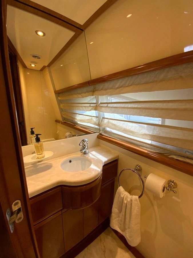 a bathroom with a sink and a mirror aboard GEMINI Yacht for Sale