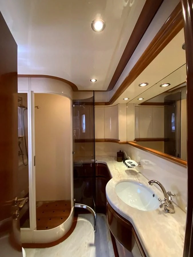 a bathroom with a sink and a mirror aboard GEMINI Yacht for Sale