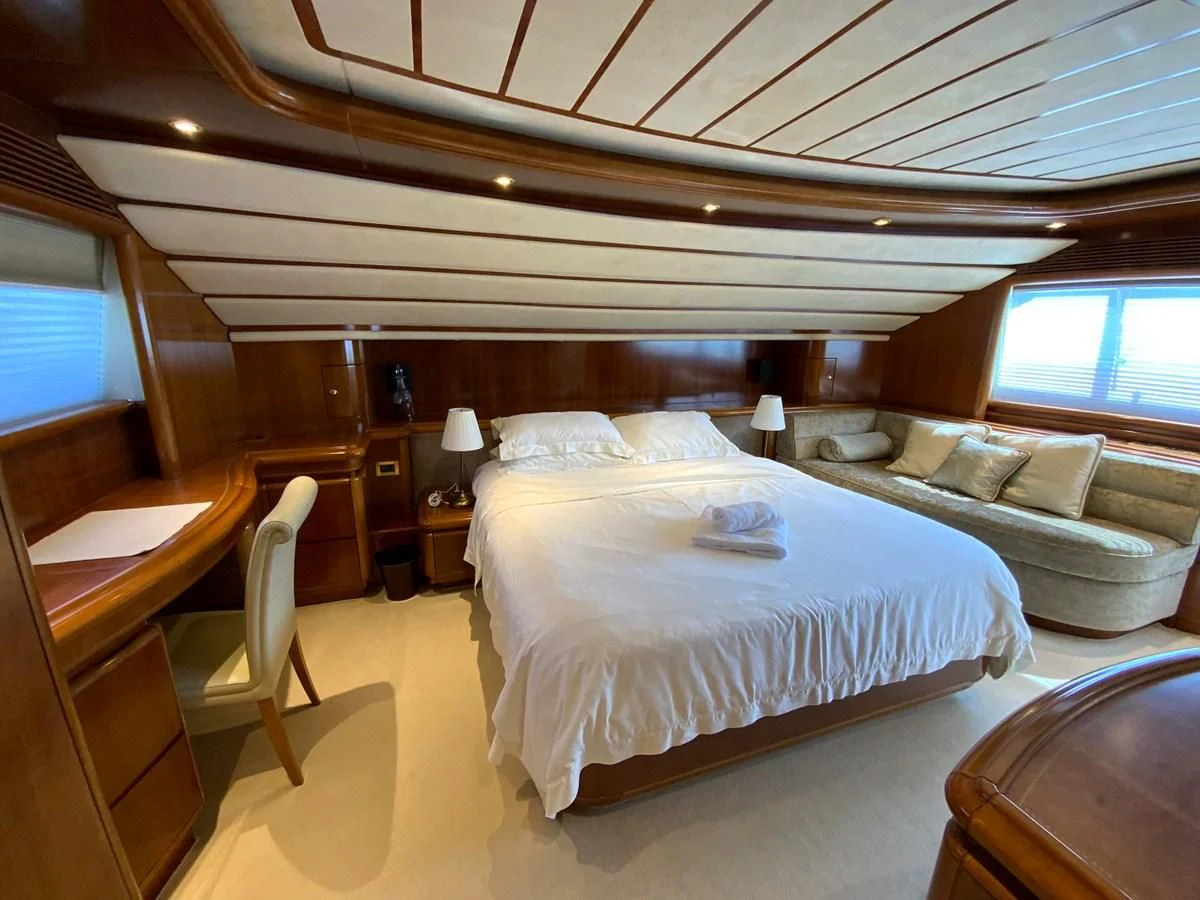 a bed in a room aboard GEMINI Yacht for Sale