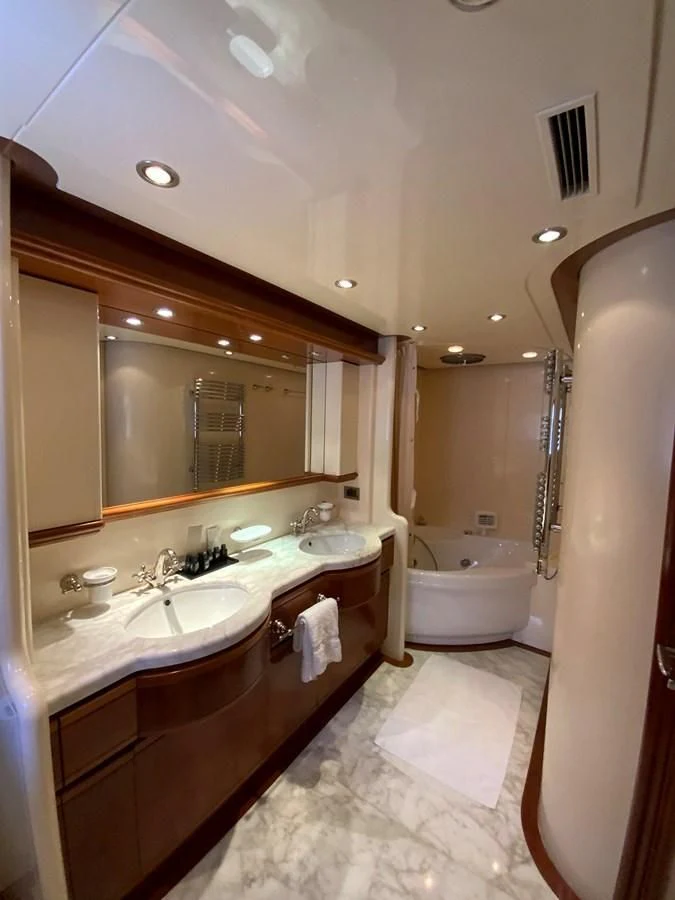 a bathroom with a large mirror aboard GEMINI Yacht for Sale