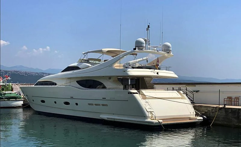 a white yacht docked aboard GEMINI Yacht for Sale