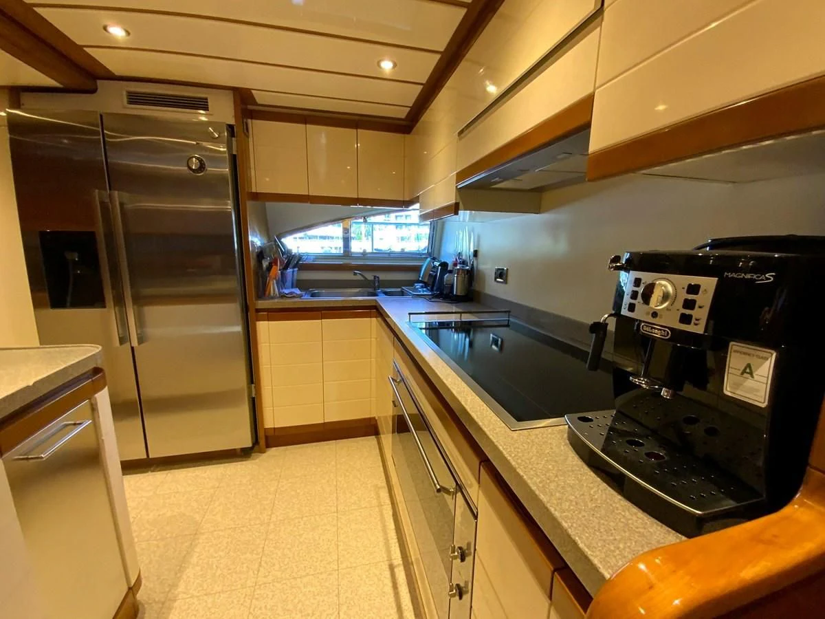 a kitchen with a refrigerator and stove aboard GEMINI Yacht for Sale