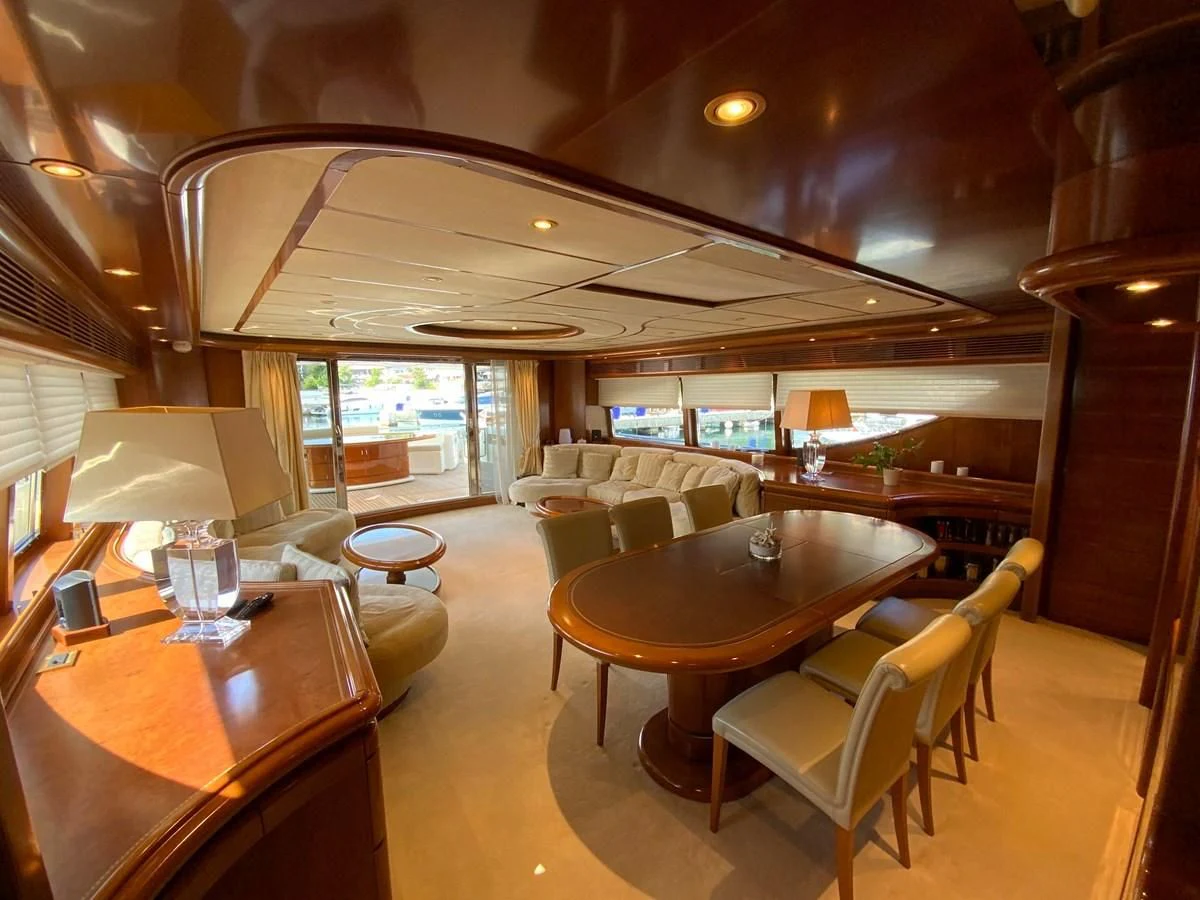 a large room with a table and chairs aboard GEMINI Yacht for Sale