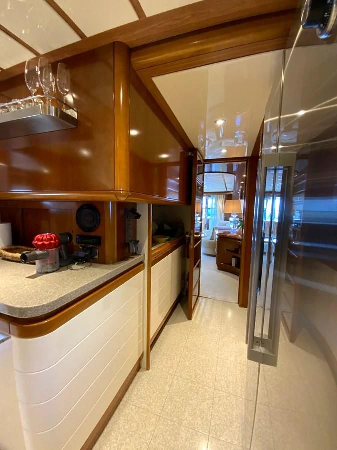 a kitchen with a large glass door aboard GEMINI Yacht for Sale