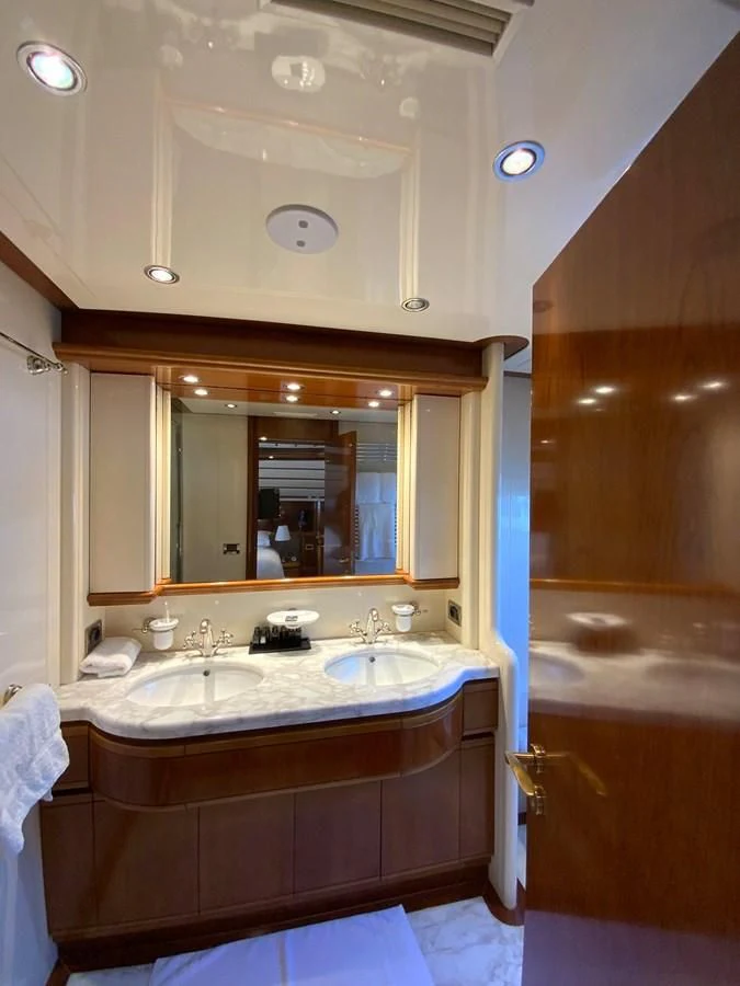a bathroom with a sink and a mirror aboard GEMINI Yacht for Sale