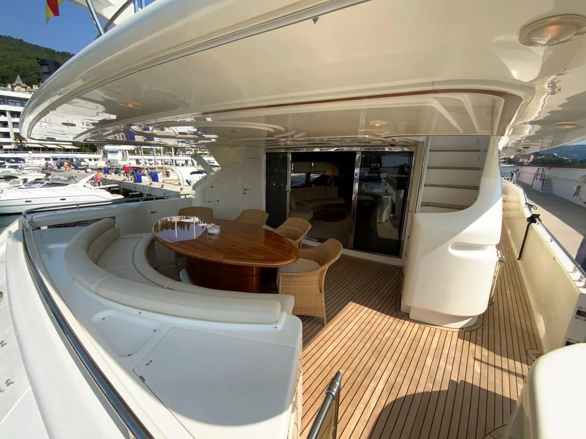 a boat with tables and chairs aboard GEMINI Yacht for Sale