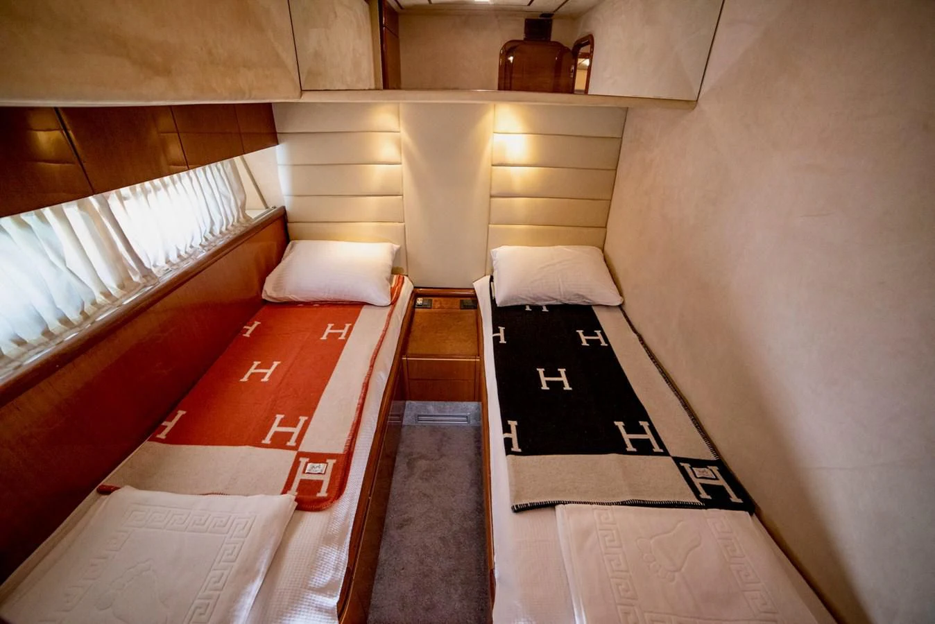 a room with a bed and a chair aboard FERRETTI Yacht for Sale