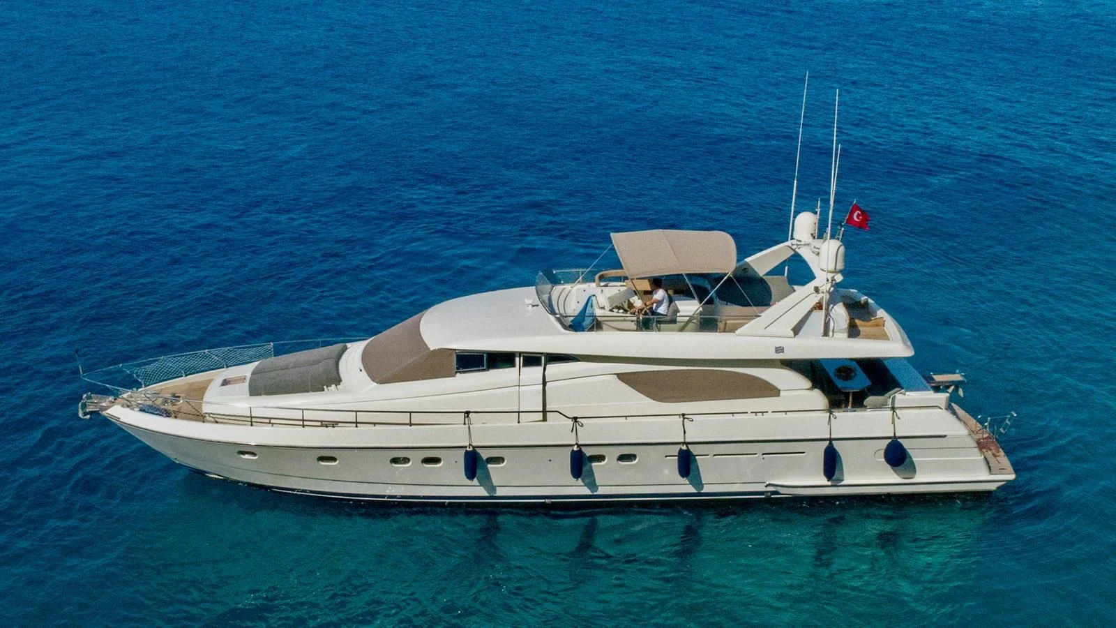 a white yacht in the water aboard FERRETTI Yacht for Sale