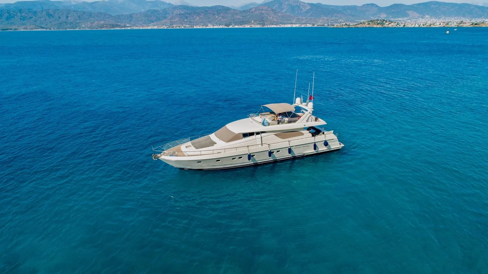 a white boat in the water aboard FERRETTI Yacht for Sale