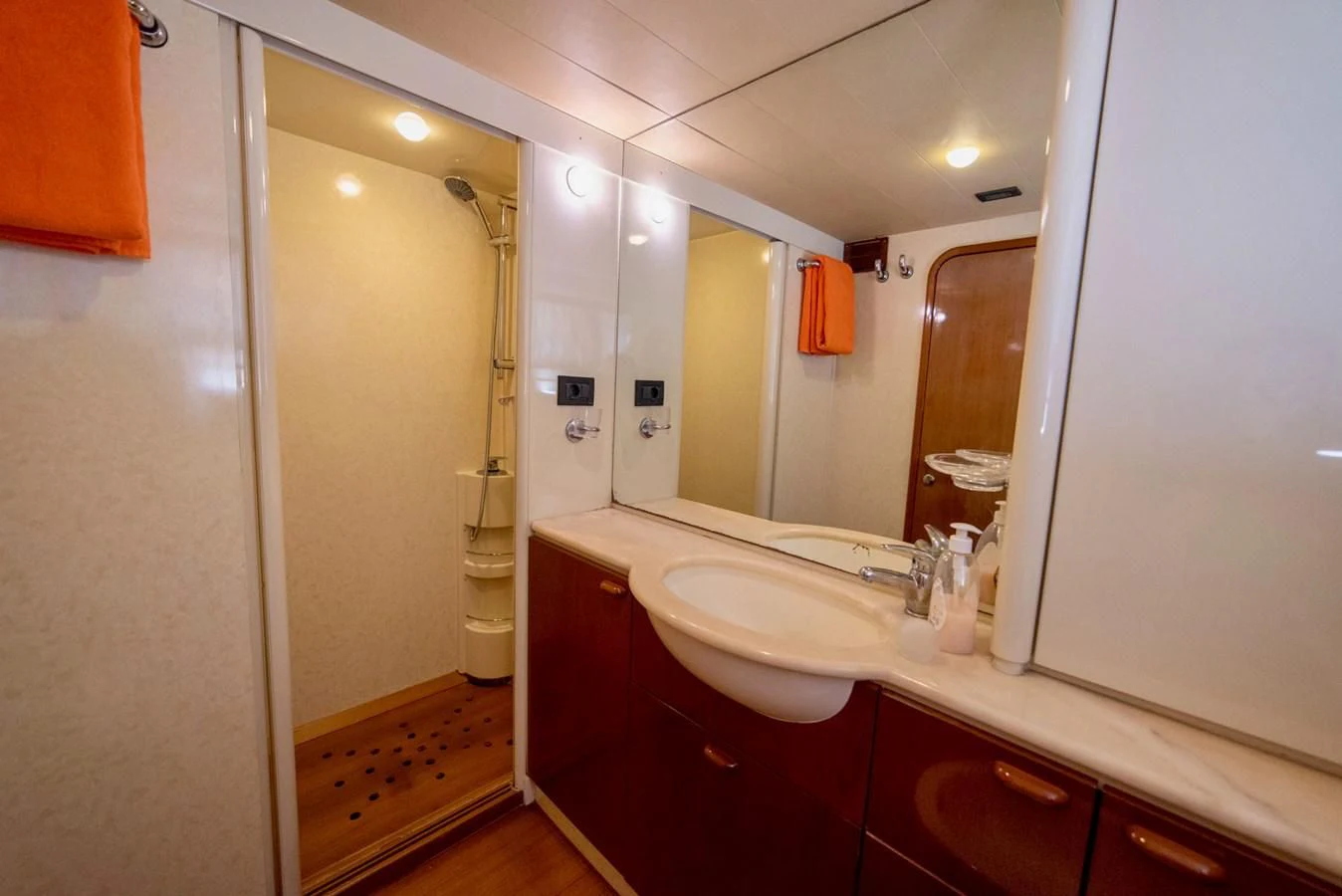 a bathroom with a large mirror aboard FERRETTI Yacht for Sale