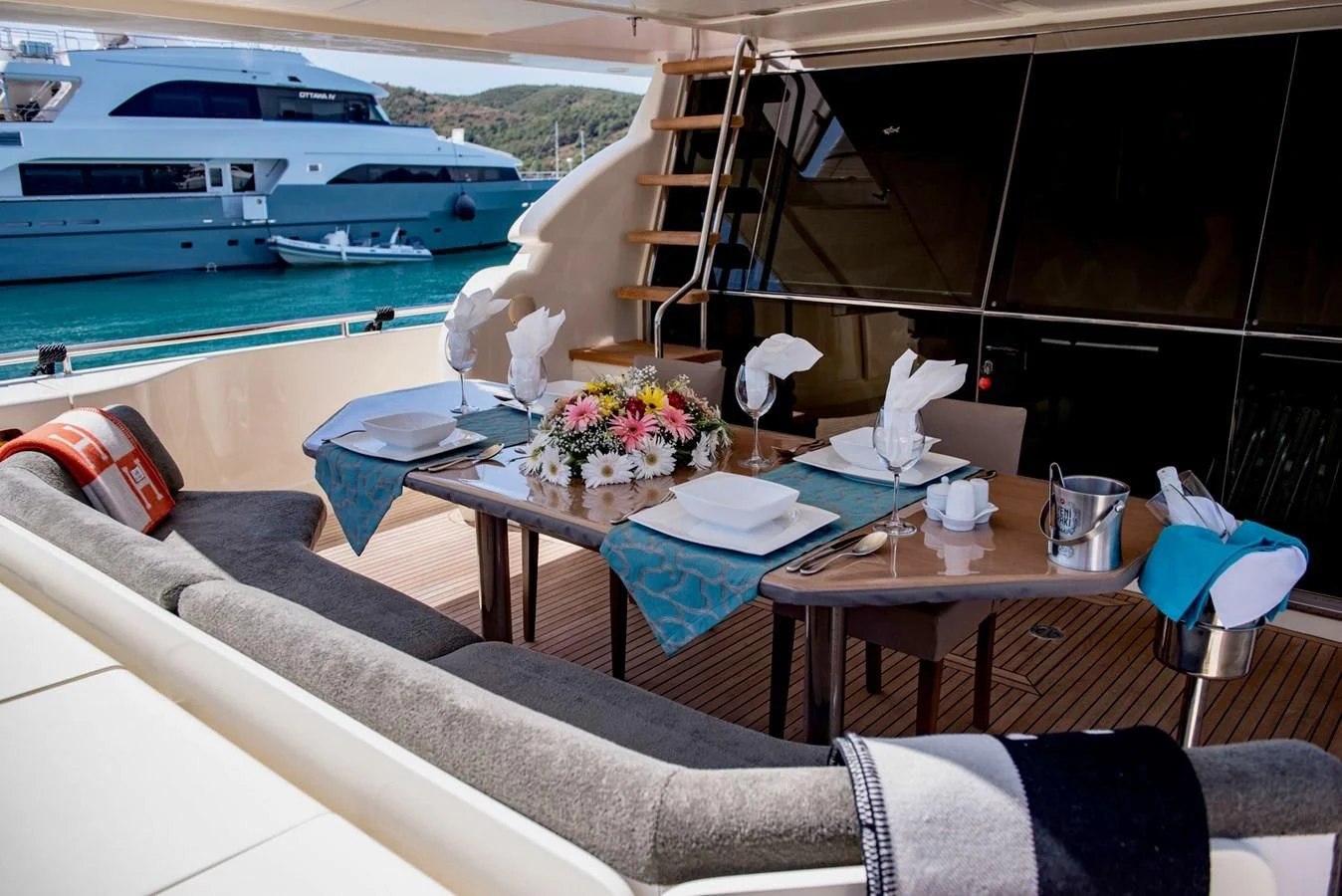 a table with a vase of flowers on it aboard FERRETTI Yacht for Sale