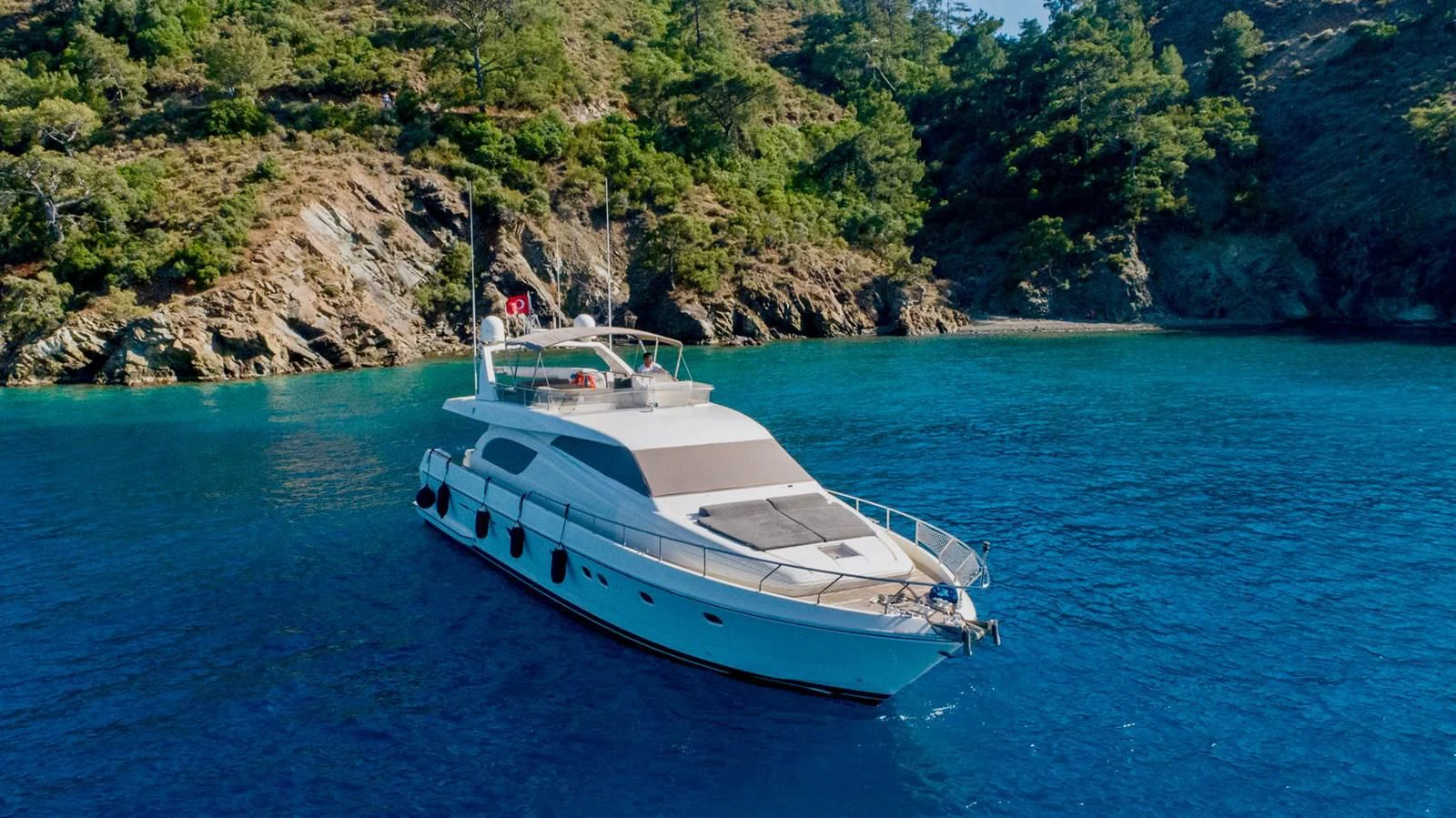a white boat in the water aboard FERRETTI Yacht for Sale