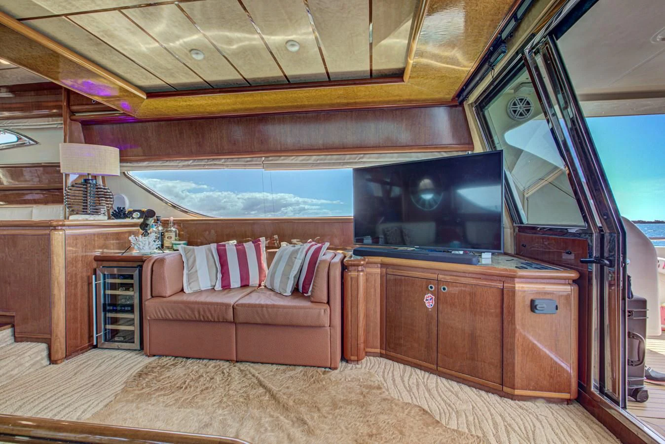 a cabin with a couch and tv aboard FERRETTI Yacht for Sale