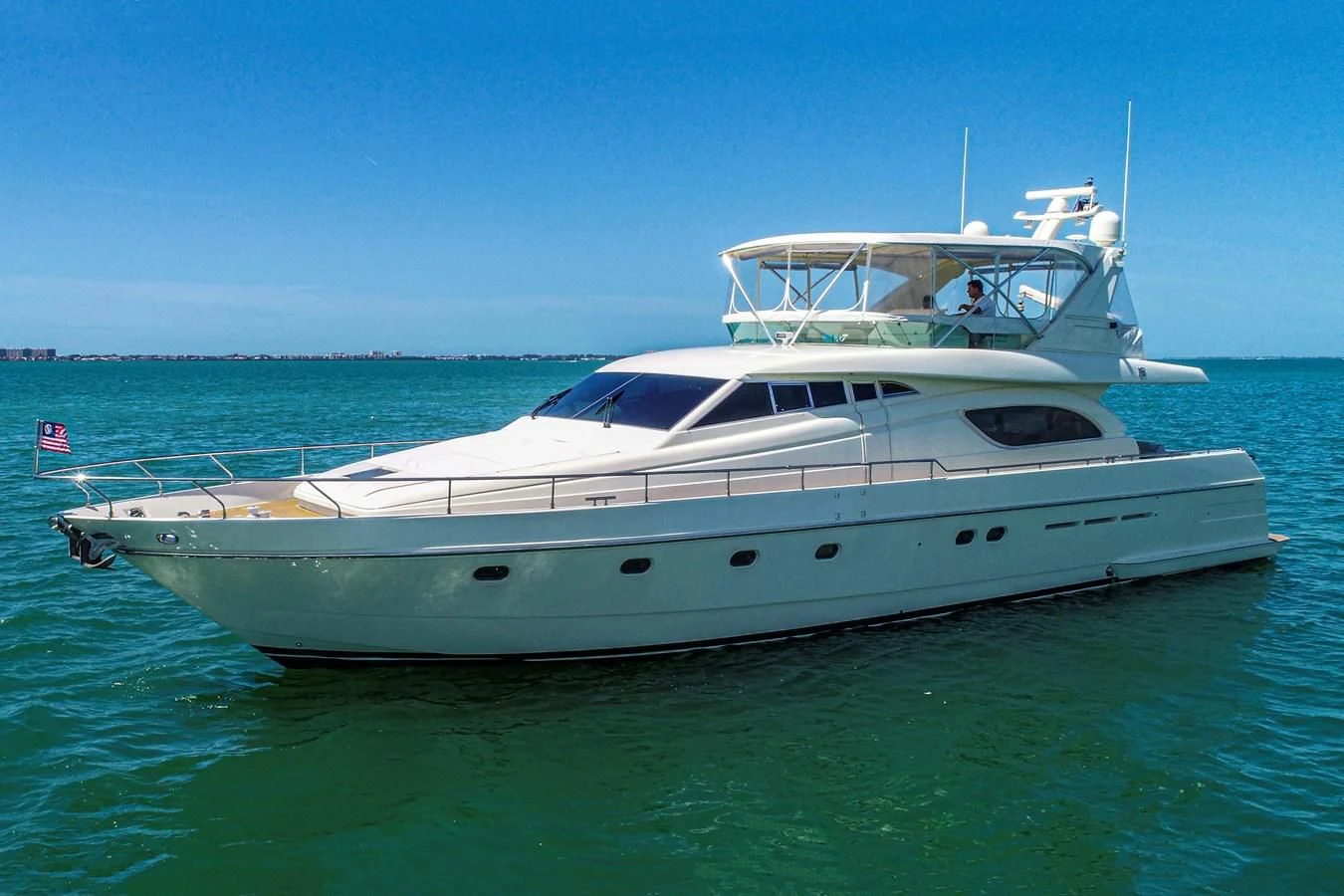 a white yacht in the water aboard FERRETTI Yacht for Sale