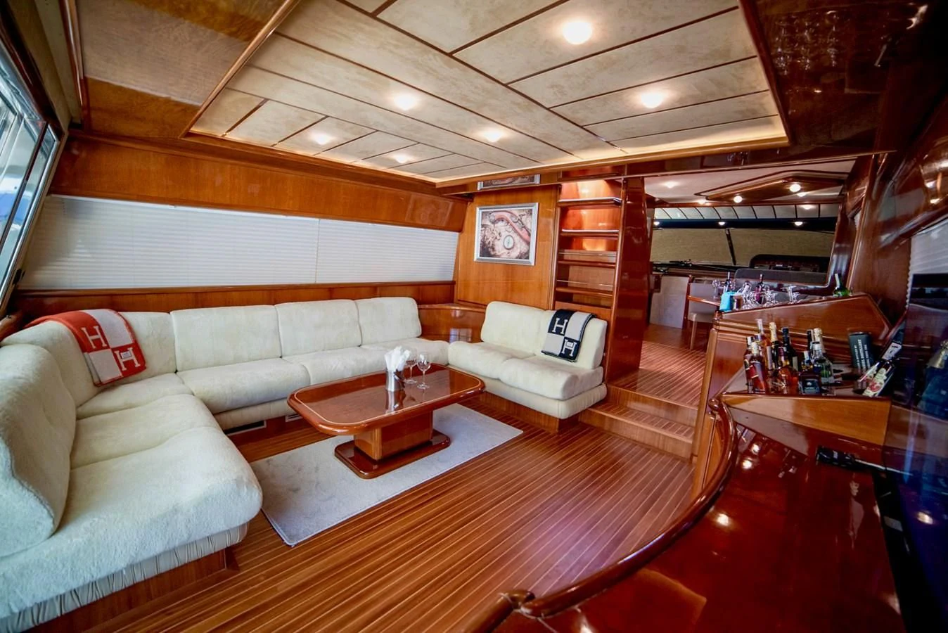 a living room with a couch and a coffee table aboard FERRETTI Yacht for Sale