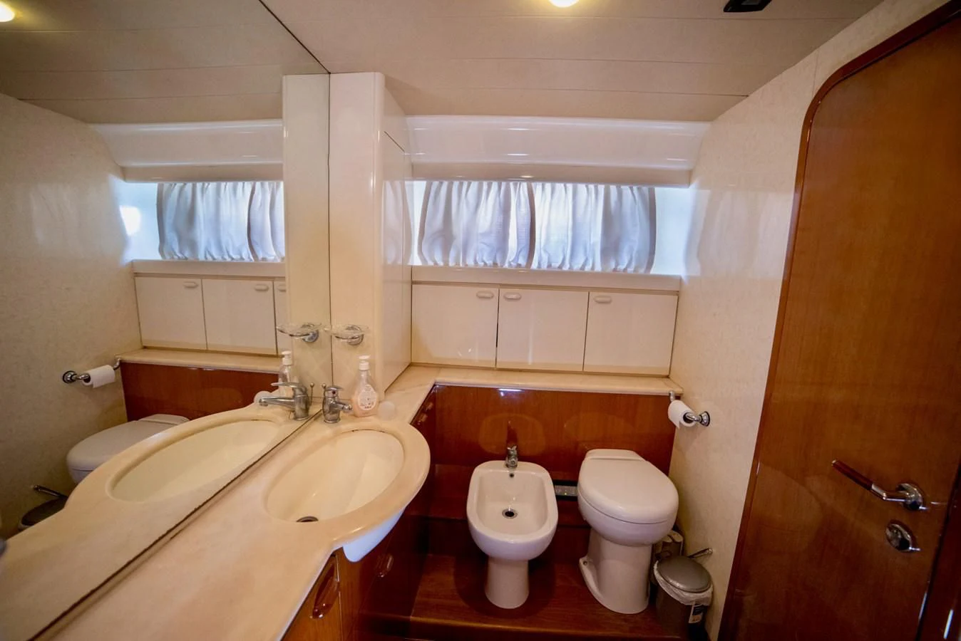a bathroom with a sink toilet and a bathtub aboard FERRETTI Yacht for Sale