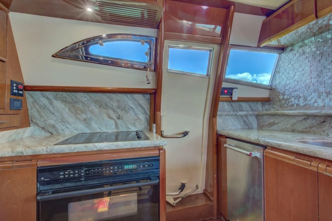 a kitchen with a large oven and a microwave aboard FERRETTI Yacht for Sale