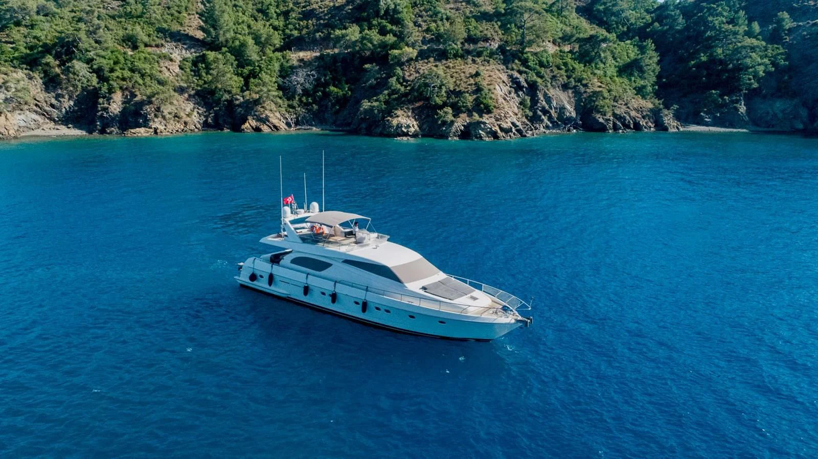 a white boat in the water aboard FERRETTI Yacht for Sale