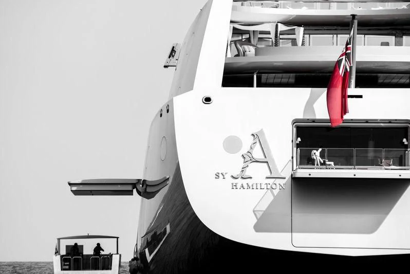 a large grey airplane with a red and white flag on the tail aboard SAILING YACHT A Yacht for Sale
