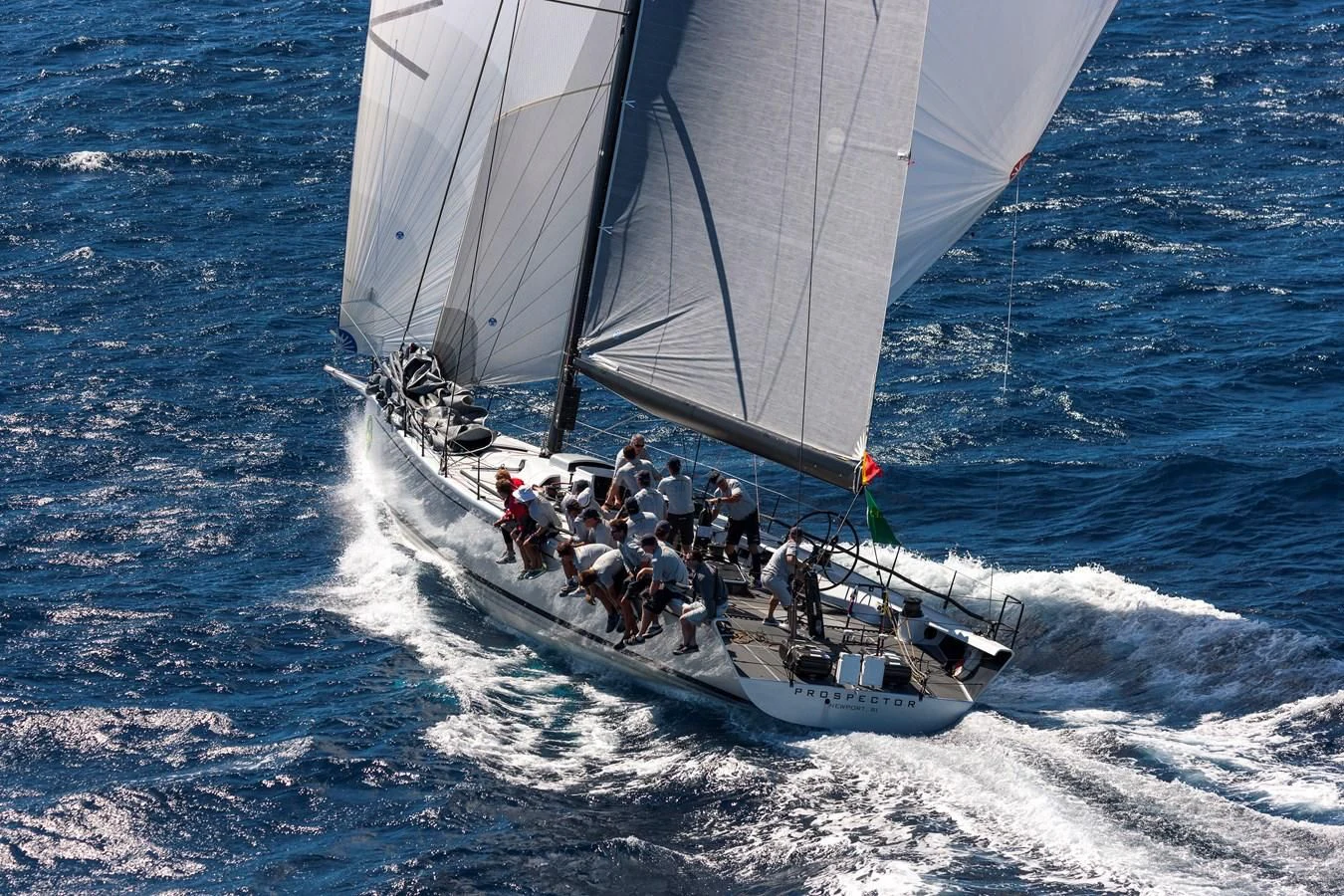 a group of people on a sailboat in the water aboard PROSPECTOR Yacht for Sale
