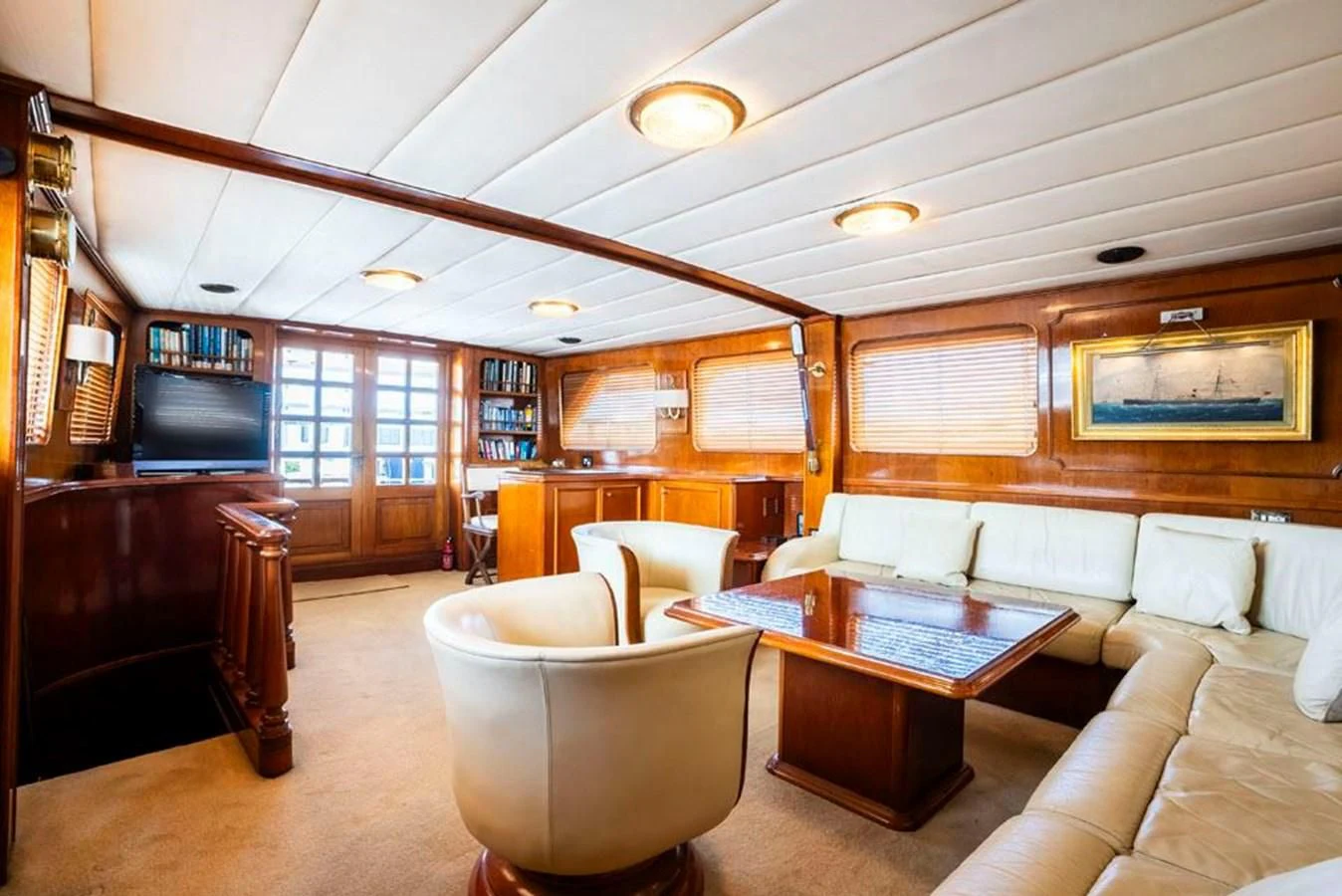 a living room with a piano and a piano aboard MAXIME Yacht for Sale