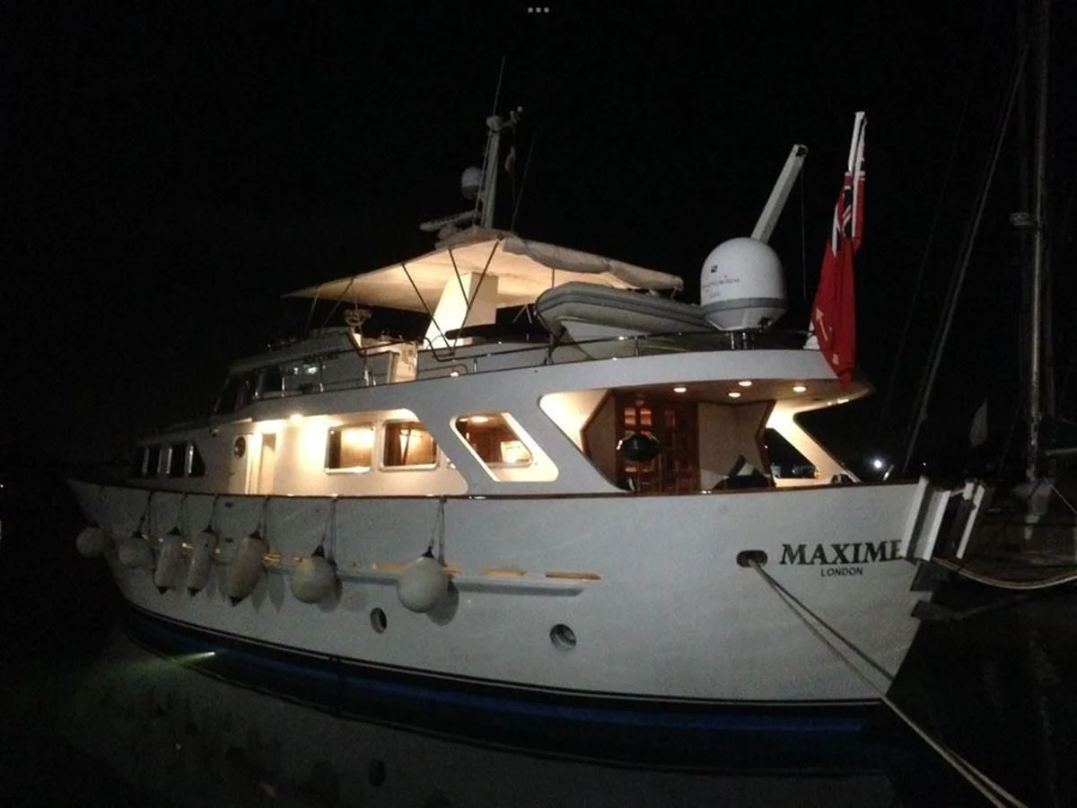 a large white boat with a red and white stripe aboard MAXIME Yacht for Sale