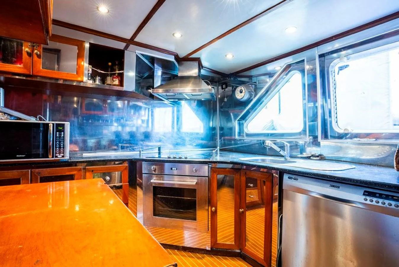 a kitchen with a large island aboard MAXIME Yacht for Sale