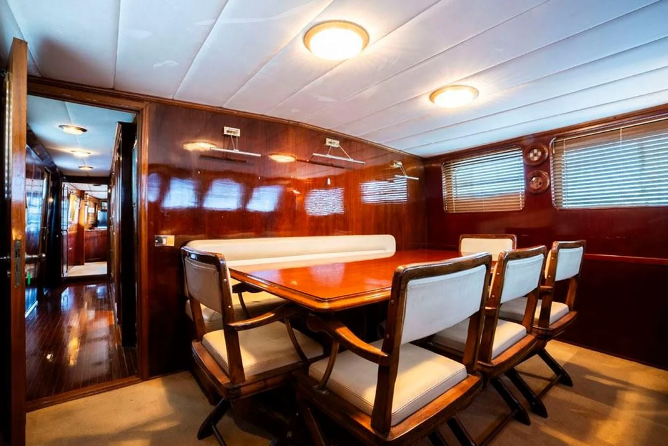 a room with a table and chairs aboard MAXIME Yacht for Sale