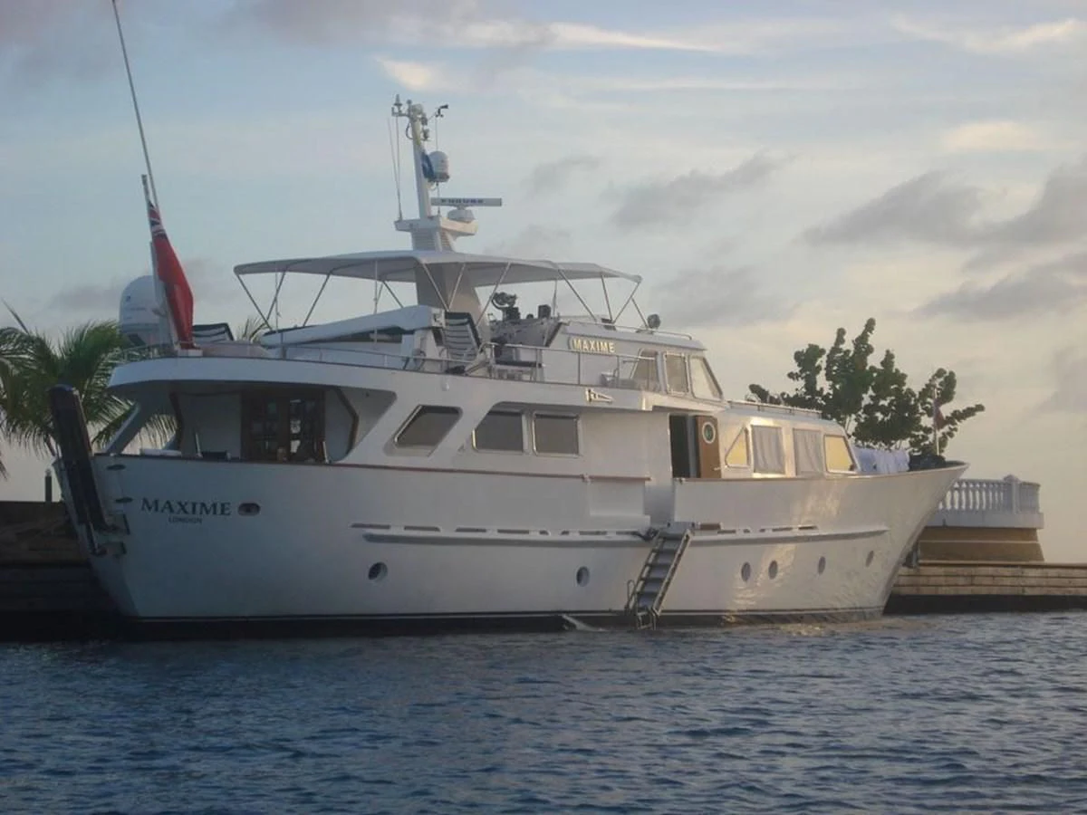 a white boat in the water aboard MAXIME Yacht for Sale