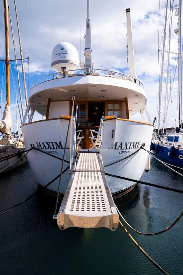 a boat docked at a pier aboard MAXIME Yacht for Sale