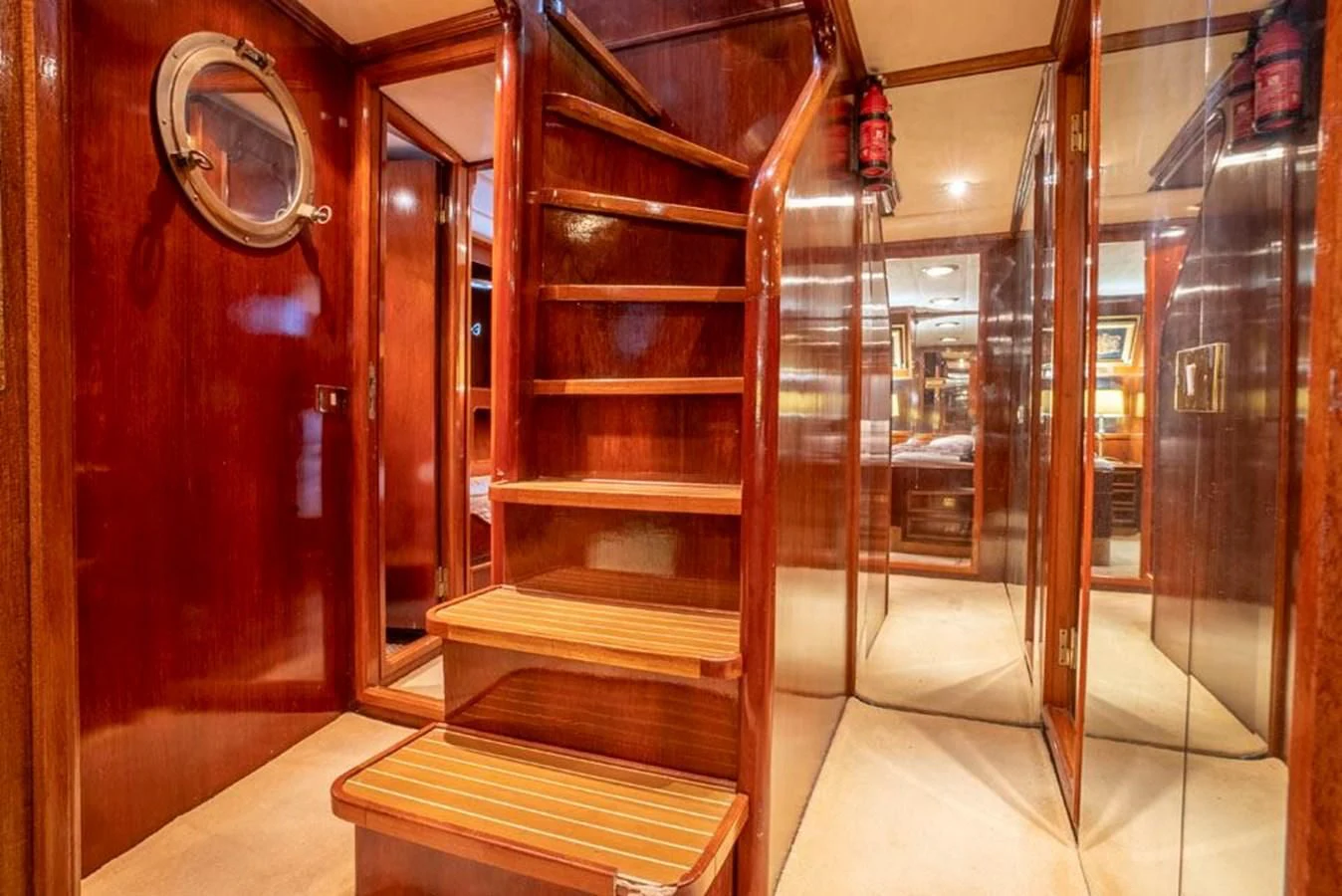 a room with a wood cabinet and a mirror aboard MAXIME Yacht for Sale