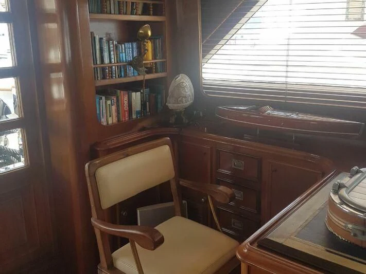 a room with a desk and a chair aboard MAXIME Yacht for Sale