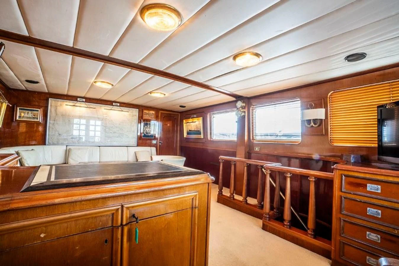 a kitchen with wooden cabinets aboard MAXIME Yacht for Sale