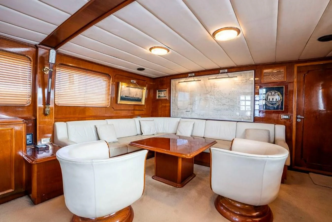 a living room with a couch and a table aboard MAXIME Yacht for Sale