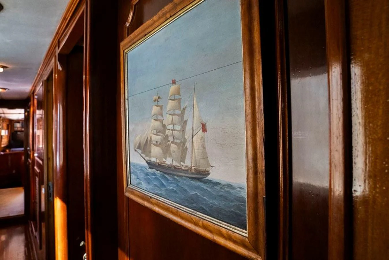 a window with a sailboat on it aboard MAXIME Yacht for Sale